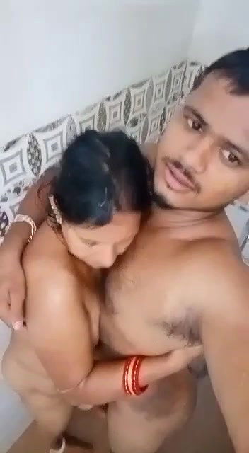Young boy having nude shower with  teacher