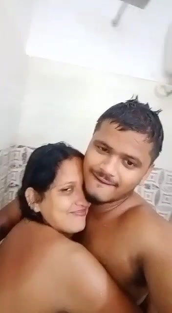 Young boy having nude shower with  teacher