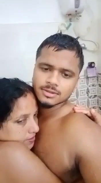 Young boy having nude shower with  teacher