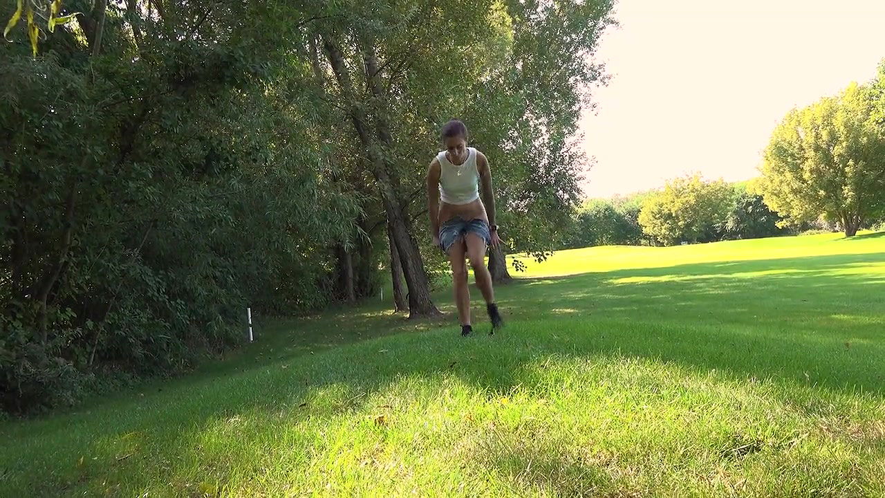 Ali B squats on a golf course to piss outside