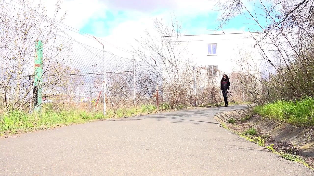 Ali B squats to pee next to the tramline