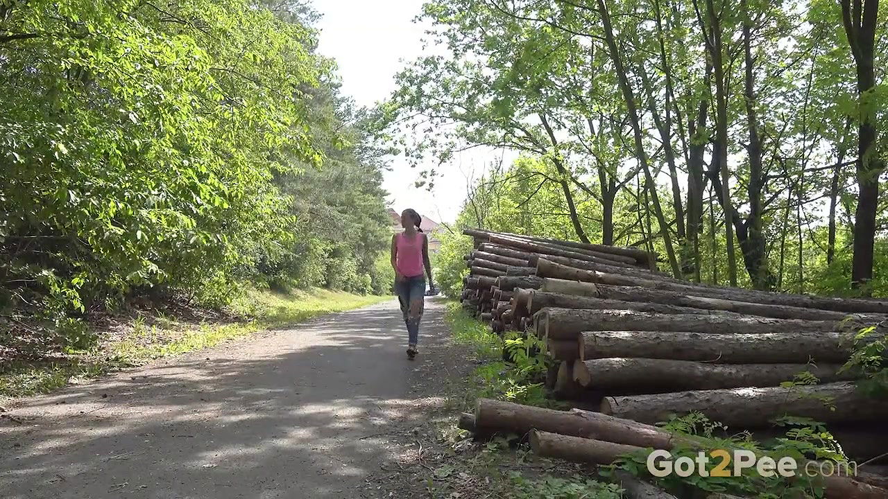 Ali Bordeaux pees near cut down logs