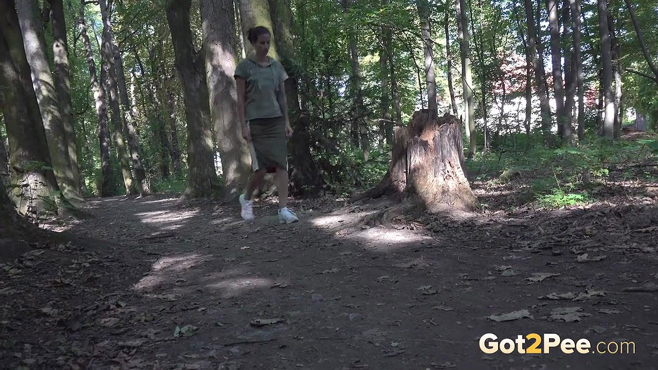 Ali Bordeaux relieves herself in the woodland