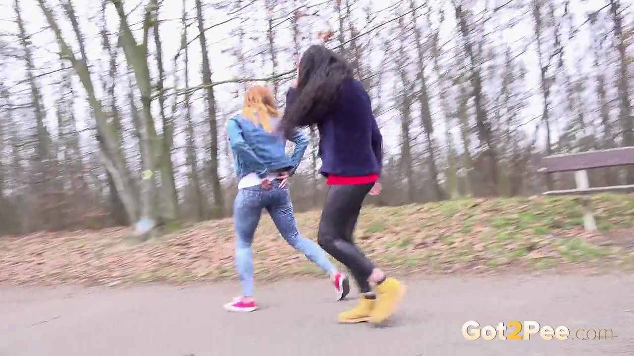 Best friends squat and piss on the ground outside
