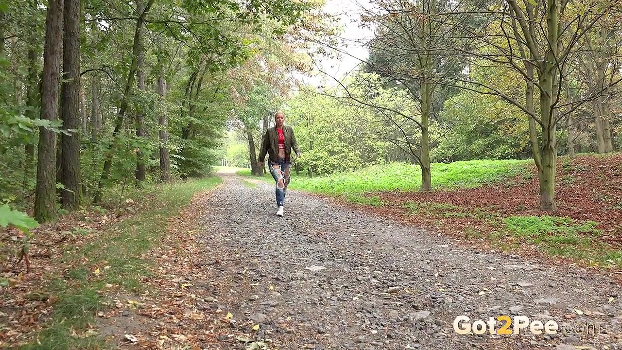 Blonde babe Chrissy relieves herself on a path