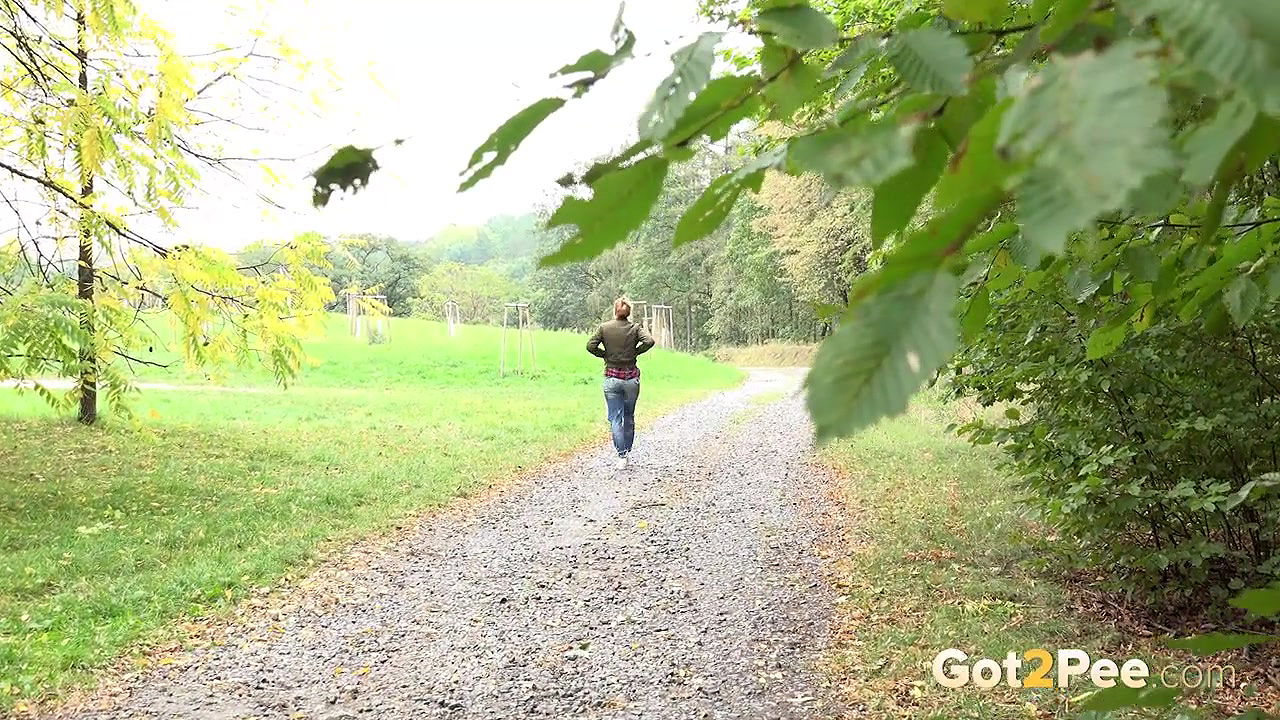 Blonde babe Chrissy relieves herself on a path