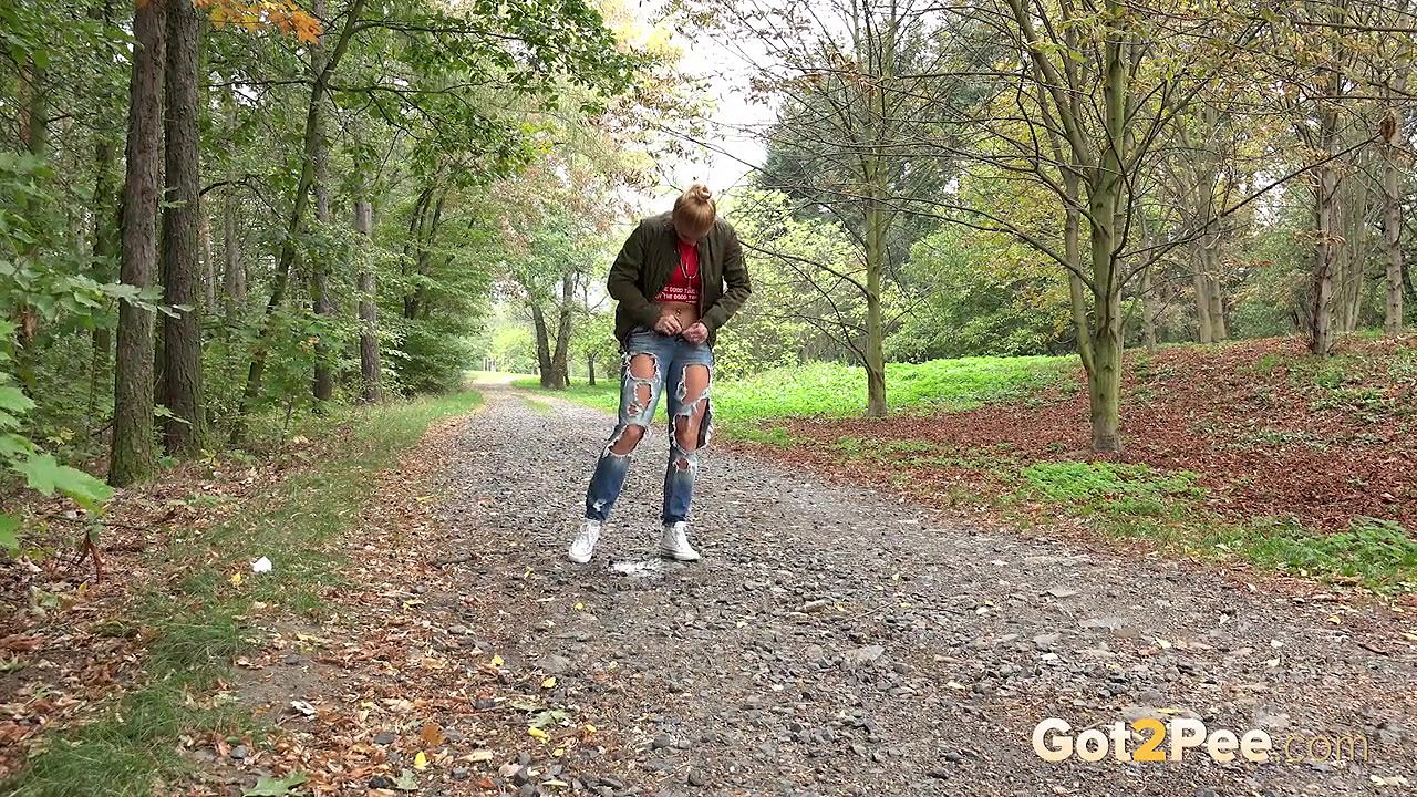 Blonde babe Chrissy relieves herself on a path