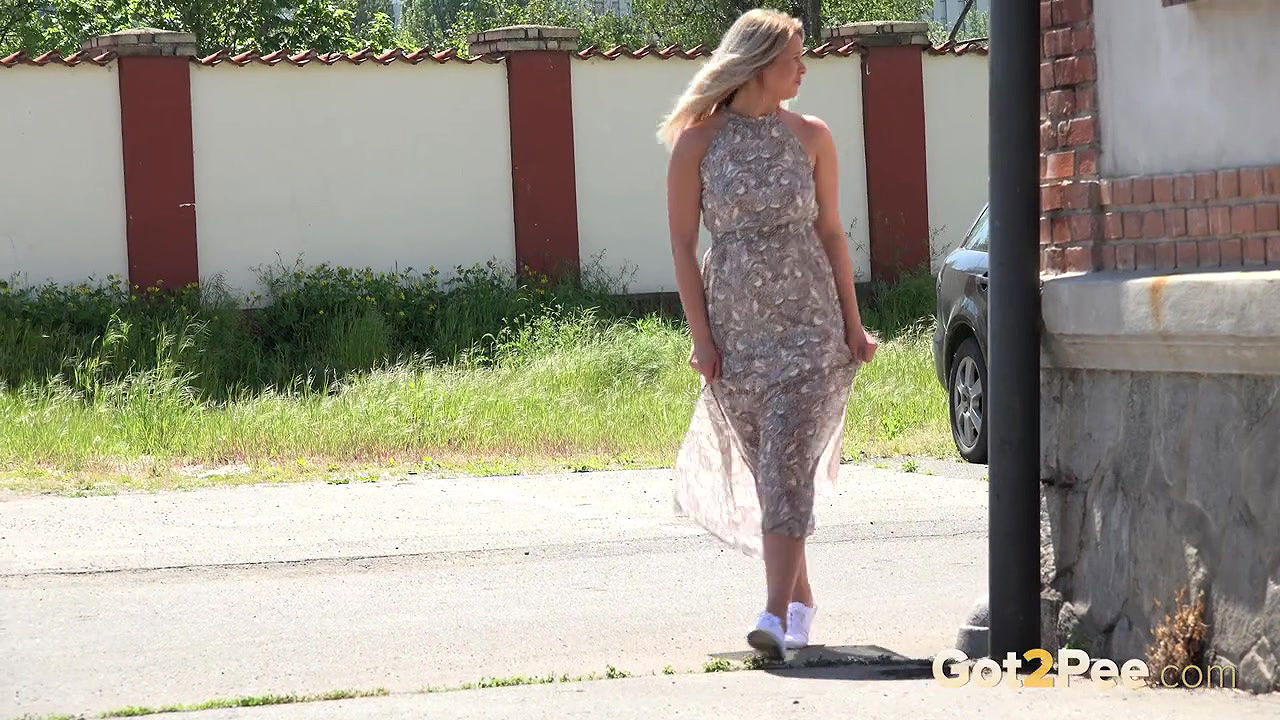 Blonde babe enjoys public pissing in the city