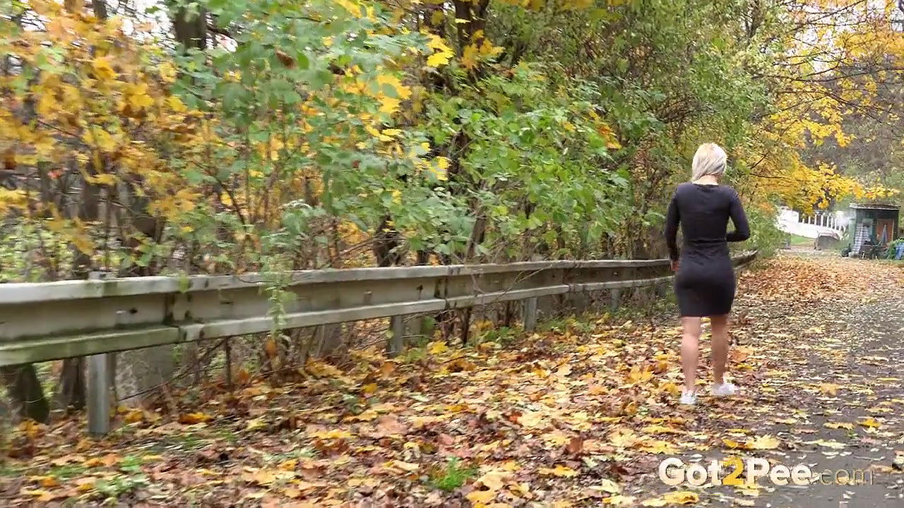 Blonde babe pisses while standing up