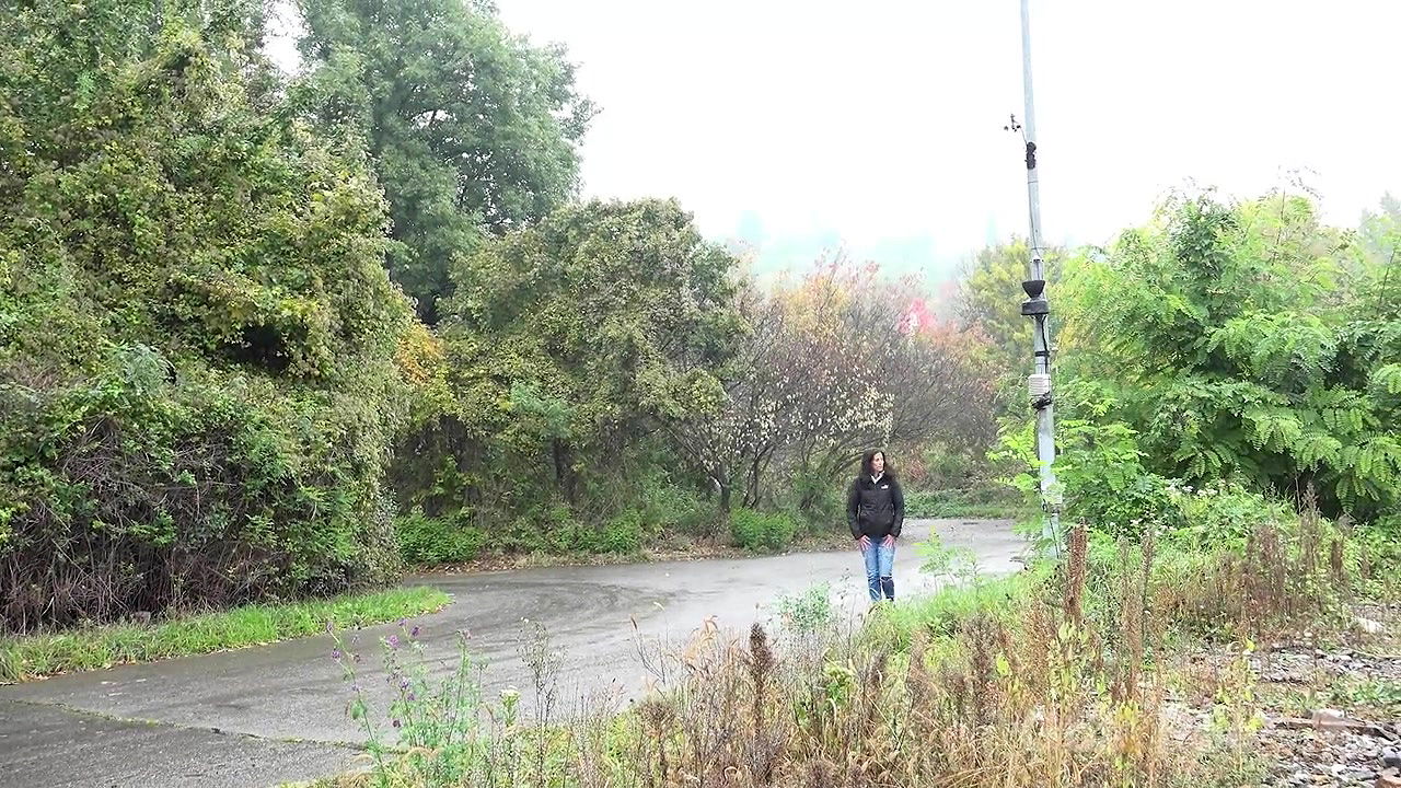 Ali B squats and pees near the train tracks