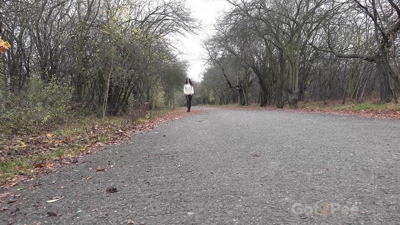 Ali B squats and pees over the ground outside