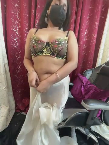 Chubby woman removing saree