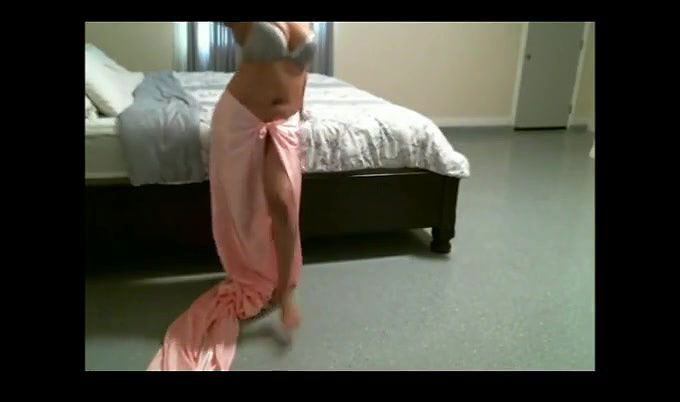 Horny Indian webcam model shows off her tits in transparent dress