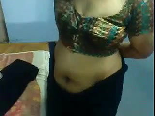 Indian aunty showing how to put on a sari