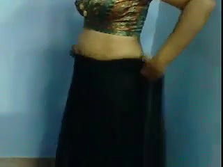 Indian aunty showing how to put on a sari