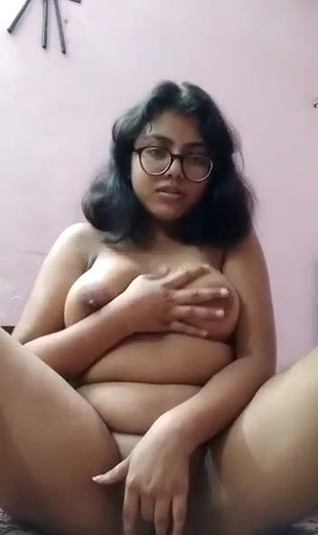 chubby Desi girl fingering her shaved pussy