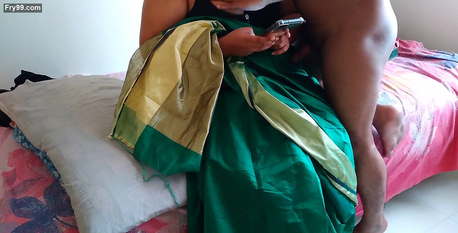 Telugu aunty in green saree with Huge Boobs on bed and fucks neighbor while watching porn on mobile – Huge cumshot