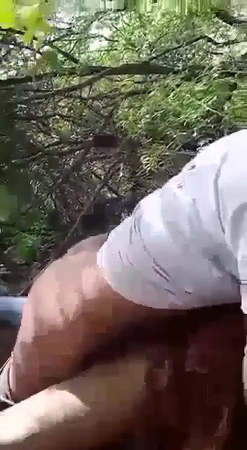couple having sex in forest