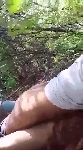 couple having sex in forest