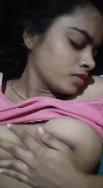teen girl pressing own boobs