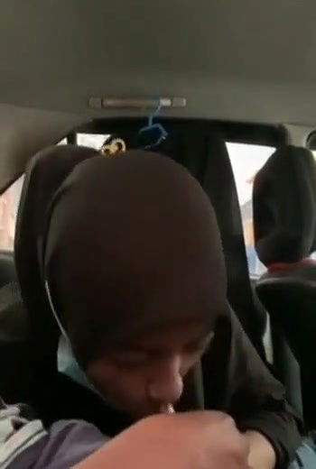 hijabi girl riding lover in car