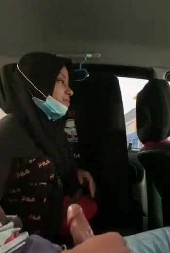 hijabi girl riding lover in car