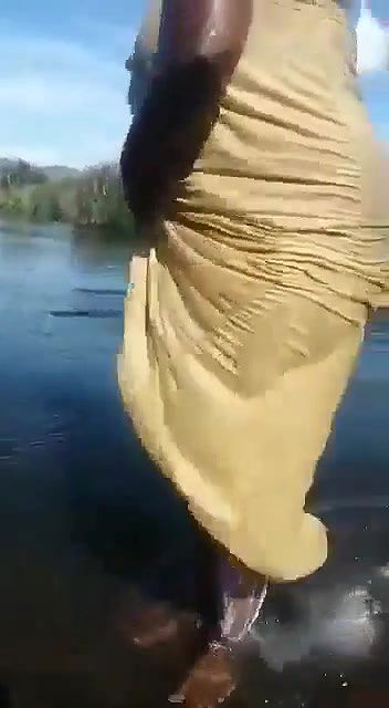 tamil wife bathing in outdoor river