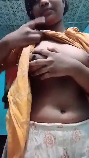 teen girl pressing own boobs