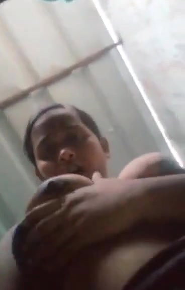 teen girl pressing own boob