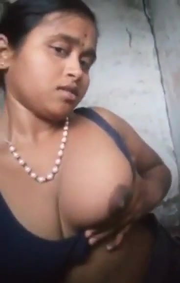 teen girl pressing own boob