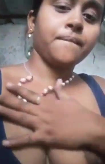 teen girl pressing own boob