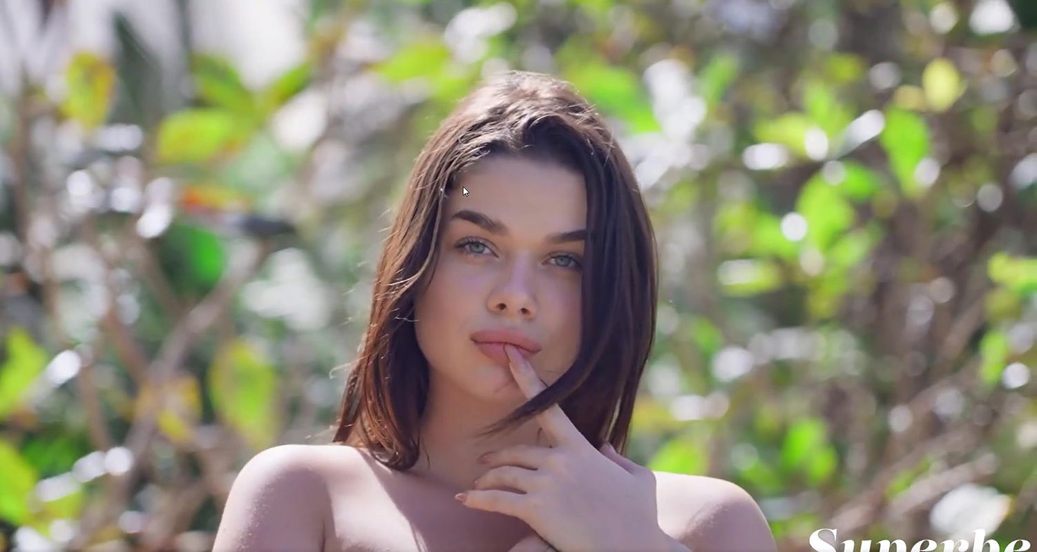 Gorgeous brunette having too much fun down at the beach as she flashes her dazzling boobs and nice ass as she gets wet