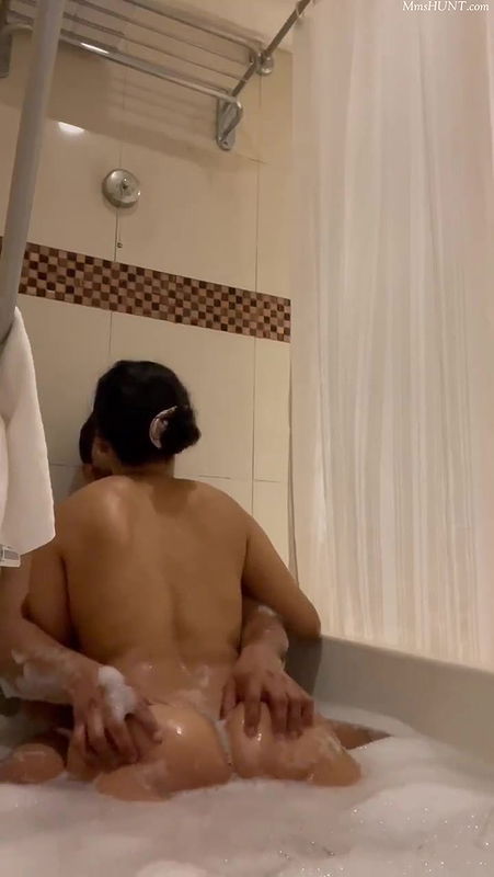 couples on bathtub kissing