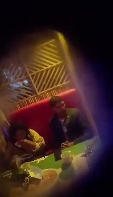 hijab couple caungt fun in restraunt