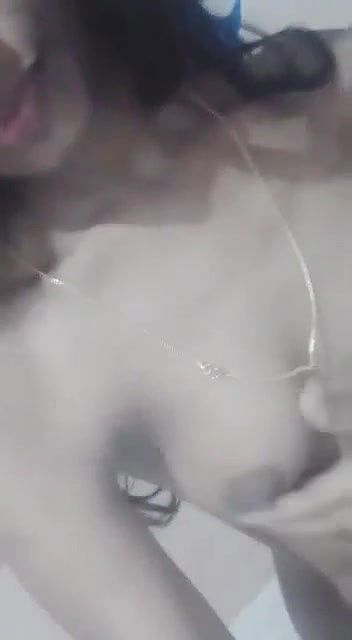 small boob girl pressing own boob