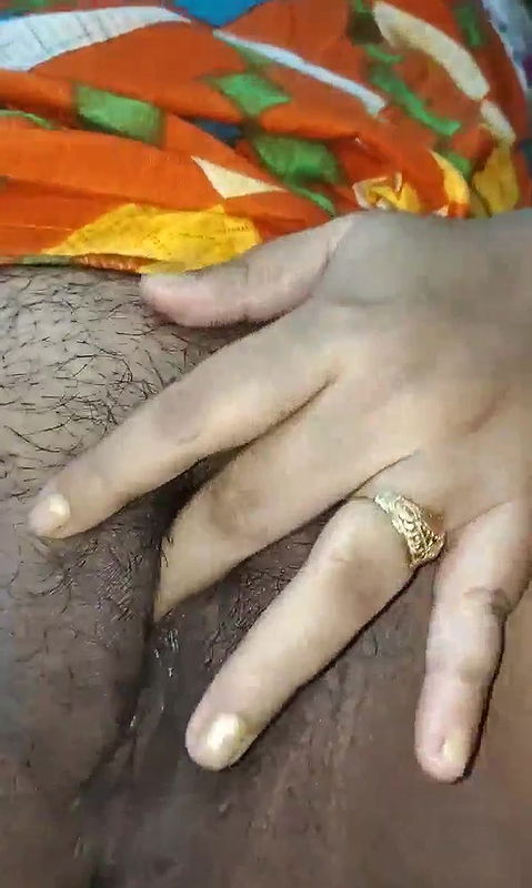 Bengali Boudi fingering her hairy pussy