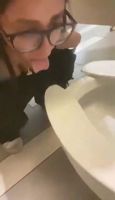 beautiful girl lick toilet seat