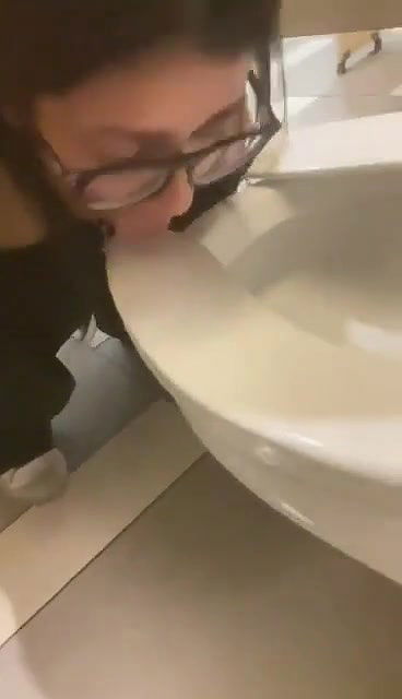 beautiful girl lick toilet seat