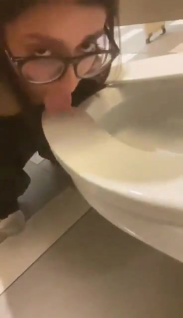 beautiful girl lick toilet seat