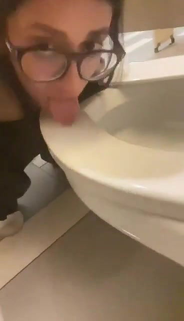 beautiful girl lick toilet seat