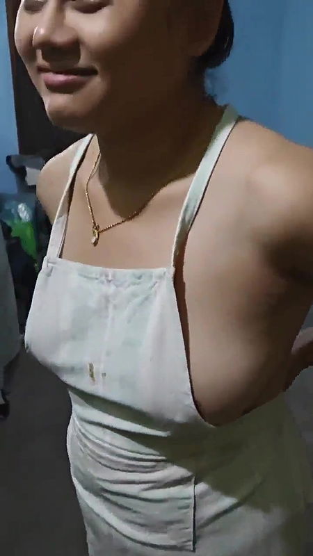 wife wearing apron video recording by boyfriend