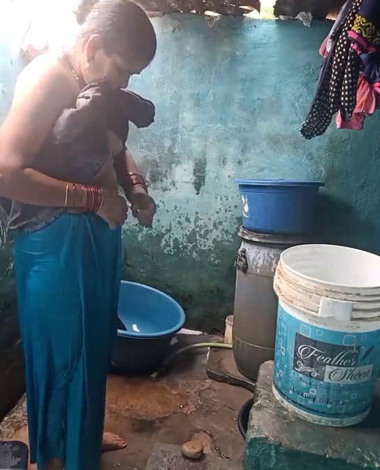 Mature topless village aunty bathing caught