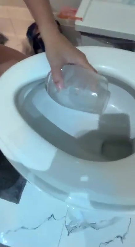 beautiful girl drinking toilet water