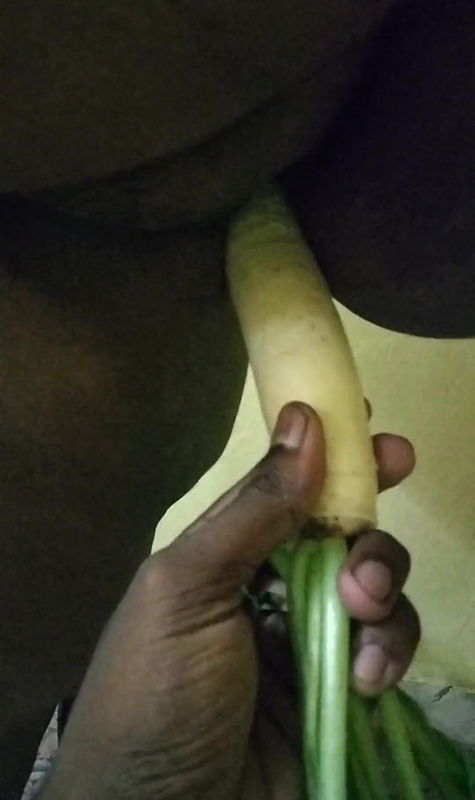 Inserting A Vegetable Into Her Pussy