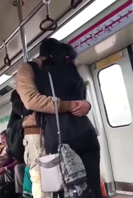 Couple kissing in delhi metro