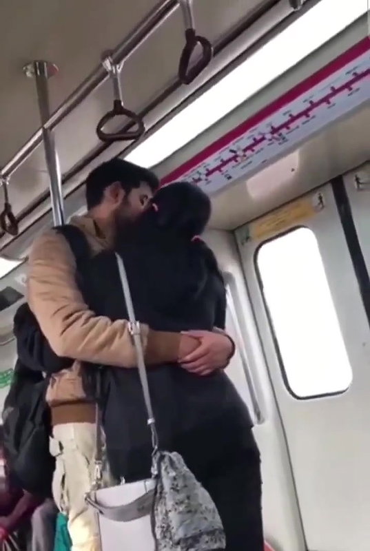 Couple kissing in delhi metro