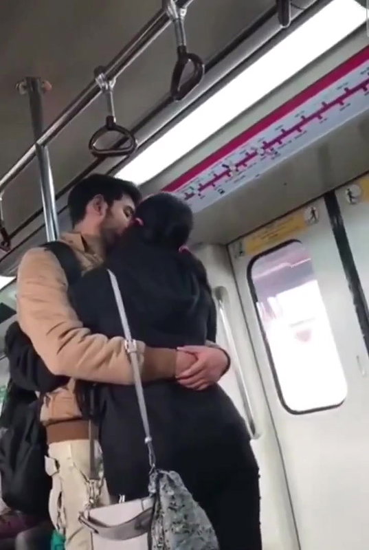 Couple kissing in delhi metro