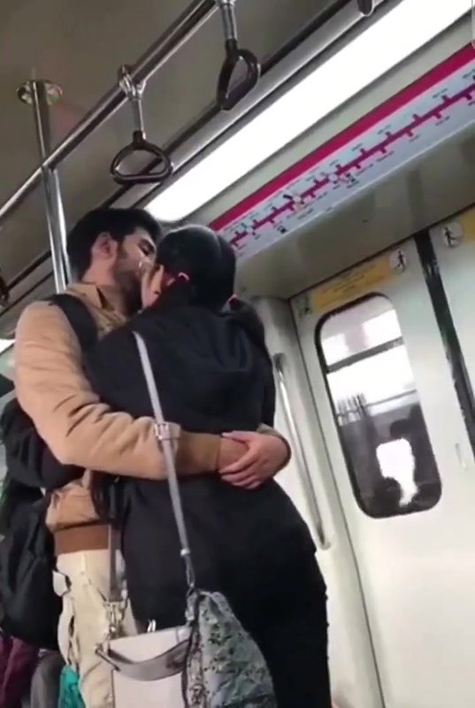 Couple kissing in delhi metro