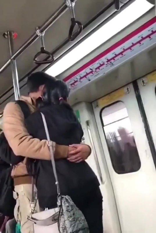 Couple kissing in delhi metro