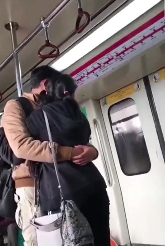 Couple kissing in delhi metro